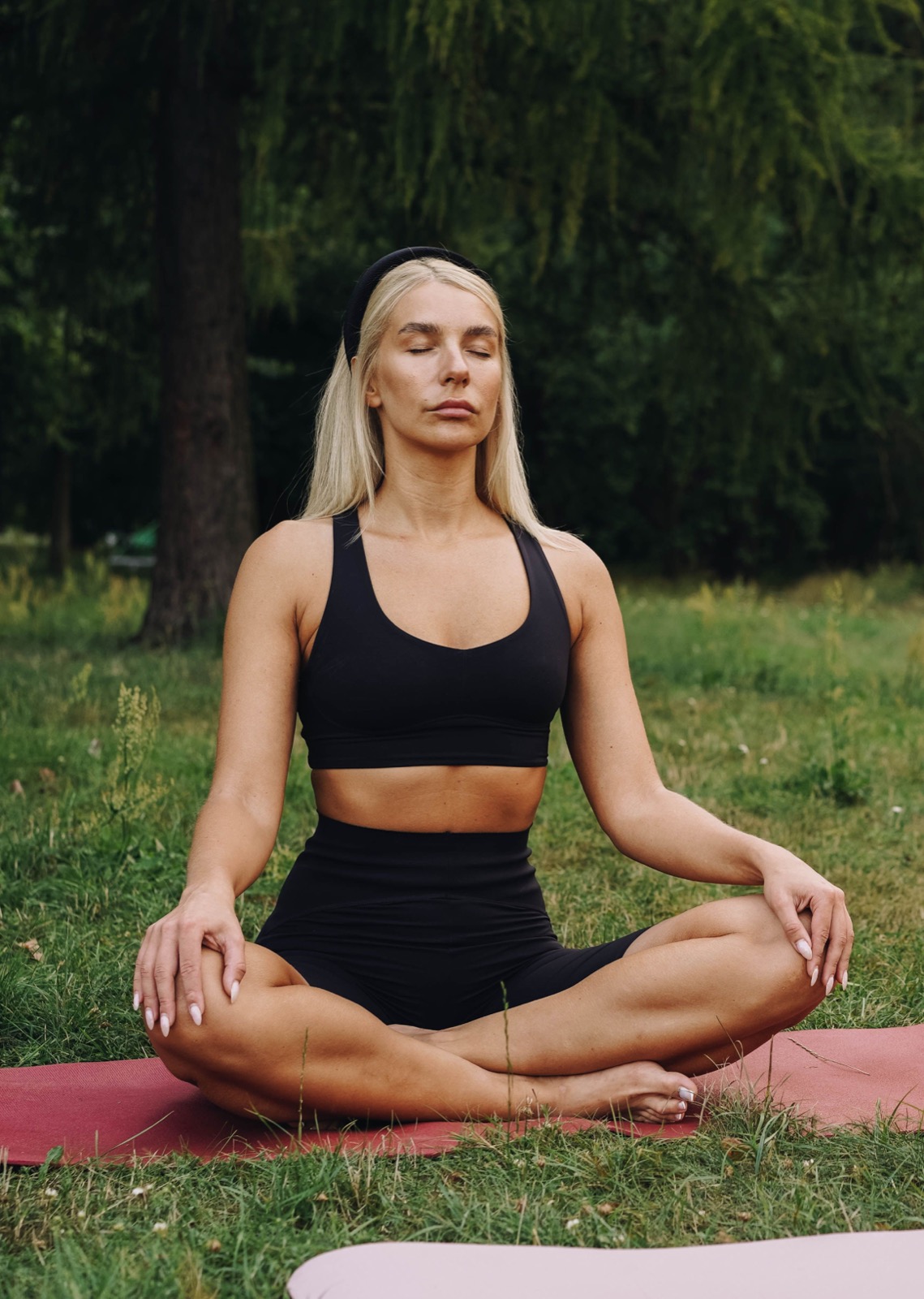 A person meditating outdoors in nature