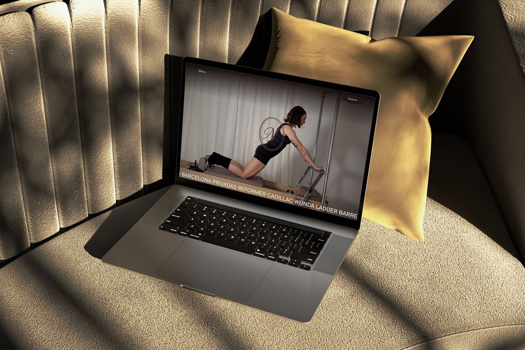 A studio website shown on a laptop